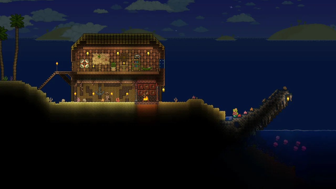 A beachside Terraria base at night